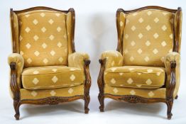 A French style salon suite comprising a two seater sofa and two chairs, upholstered in gold fabric,