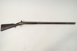 A 12 gauge muzzle loading Flintlock shot gun,