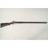 A 12 gauge muzzle loading Flintlock shot gun,