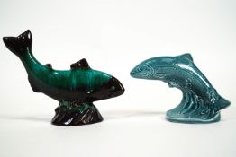 Two Poole pottery leaping salmon figures, one in blue the other in streaked turquoise,