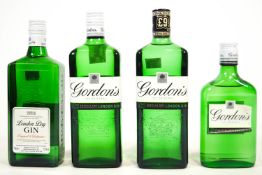 A crate of alcohol, comprising four bottles of Gordon's Gin, a bottle of Stretton's Gin...