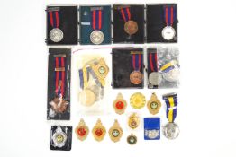 A collection of assorted base metal Bisley Shooting Award medals,