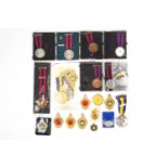 A collection of assorted base metal Bisley Shooting Award medals,