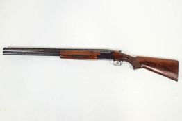 A 12 gauge 'Winchester' over and under Shotgun marked Serial No.