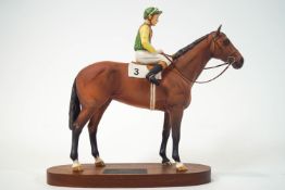 A Beswick figure of the race horse, Nijinsky with Lester Piggot up, on mahogany plinth,