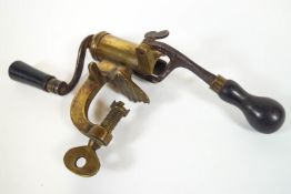 A 19th century brass and hardwood cartridge charger,