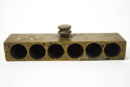 A brass cartridge holder for six, stamped 2 Dram,