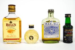 A group of assorted spirit miniatures, to include Cointreau and Grand Marnier,