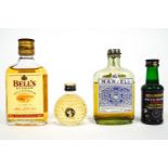 A group of assorted spirit miniatures, to include Cointreau and Grand Marnier,