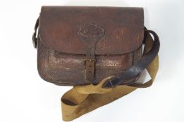 A leather cartridge bag with adjustable shoulder strap, 18cm high,