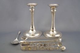 A pair of silver George III cast and pierced shell end sugar tongs, 13cm long,