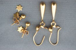 A collection of two pairs of yellow metal earrings;