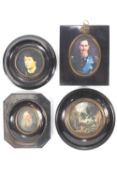 A group of four miniature style prints in an assortment of black japanned frames,