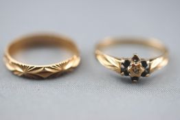 A collection of two yellow metal rings