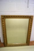 A large wall mirror with gold effect frame,