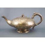 A silver plain bodied melon form teapot,