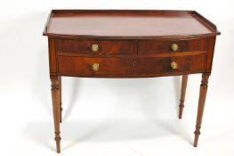 A 19th century mahogany wash stand with raised back above two short and one long drawer
