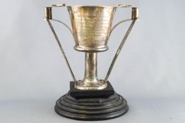 A silver two handled Libation cup, modelled after the classical antique, with thumb piece handles,