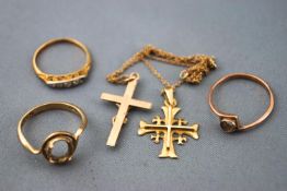 A collection of yellow gold jewellery to include: A fine trace link chain with two cross pendants;