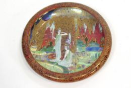 A Wilton ware bowl, decorated with figures in a garden in Fairyland lustre style,