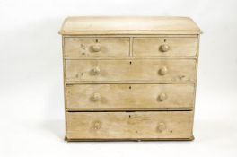 A Victorian pine chest of two short and three long drawers with turned handles,