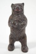 A novelty cast iron money box, in the form of a bear standing on its hind legs,