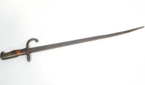 A Victorian bayonet with T section steel blade, mounted on a brass and hardwood handle,