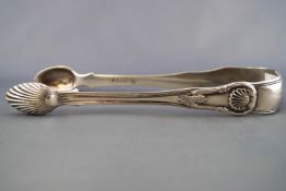 A pair of large scale silver sugar tongs, in the fiddle, thread and shell pattern,