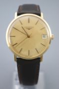 A gold plated Longines wristwatch. Round gold dial with baton markings and date feature.