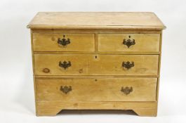 A late Victorian pine chest of two short and two long drawers on bracket feet,