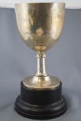 A silver Chalice form trophy, with ovoid bowl on plain stem, raised on a flared foot,