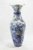 A large Chinese porcelain floor vase, of baluster form with undulating lid top,
