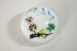 A William Manson paperweight, depicting a bird on a floral bough on a white ground,