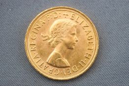 A yellow gold full sovereign coin, dated 1957.