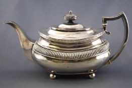 A silver large form rounded rectangular teapot,