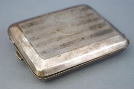 An Art Deco silver rectangular form engine turned decorated cigarette case,