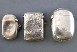 A silver vesta of bulbous oval form, by Samson Mordan (?) London 1898, with another similar,
