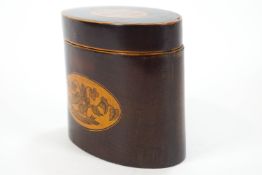 An late 18th century oval mahogany tea caddy, inlaid with baskets of flowers,