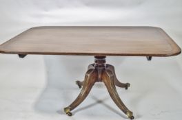 A late Regency mahogany breakfast table set a rectangular top