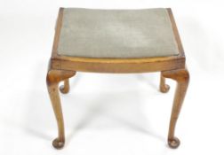 A mahogany rectangular stool with inset seat on cabriole legs with pad feet,