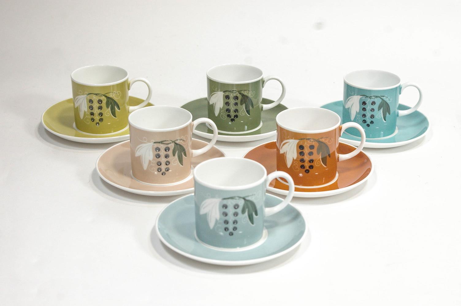 A Susie Cooper 'Harlequin' coffee service, comprising six coffee cans and saucers,