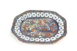 A Chinese export porcelain plate, decorated in under glaze blue and painted with klobbered enamels,