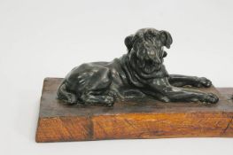 A pair of late 19th century bronze figures of Saint Bernard's reclining,