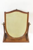 A late 19th century mahogany swing frame mirror, on rectangular base,