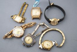 A collection of six dress watches of varying metals to include an omega ladymatic, A bulova,