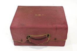 A gentleman's green pig skin travelling dressing case, with outer canvas protector cover,