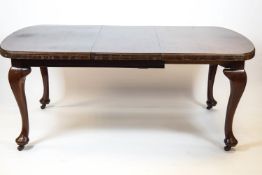 A mahogany extending dining table with one loose leaf, 72cm high x 179cm wide x 104cm deep,