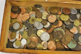 A mahogany box containing mixed coinage, of various dates and nationalities,