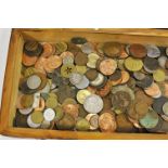 A mahogany box containing mixed coinage, of various dates and nationalities,