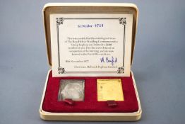 A cased set of royal silver wedding commemorative replica stamps .